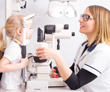 A child having her eyes examined
