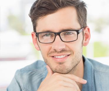 Caucasian male wearing glasses and looking at camera